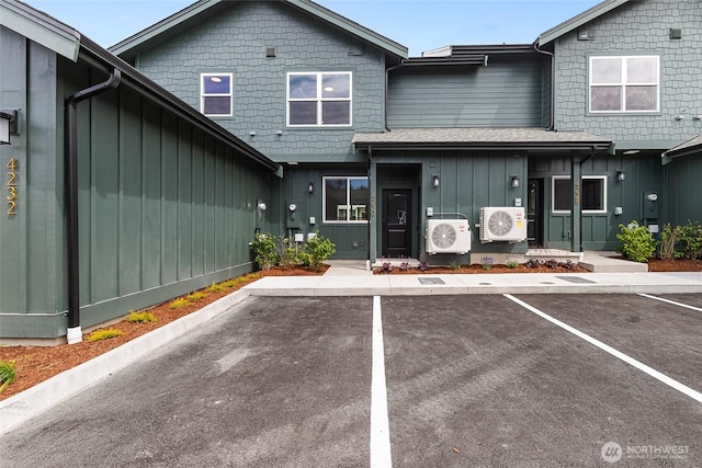 4230 Melrose Ln, Bellingham, WA 98226 - view of property featuring board and batten siding and uncovered parking
