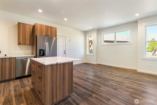 4232 Melrose Ln, Bellingham, WA 98226 - kitchen featuring stainless steel appliances, brown cabinets, dark wood-style floors, modern cabinets, and recessed lighting
