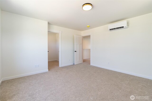 4232 Melrose Ln, Bellingham, WA 98226 - unfurnished bedroom featuring a wall mounted air conditioner, light carpet, baseboards, and a spacious closet