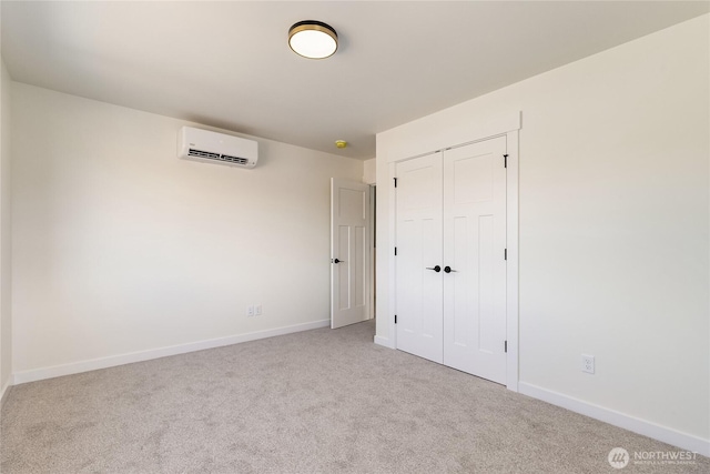 4232 Melrose Ln, Bellingham, WA 98226 - unfurnished bedroom featuring an AC wall unit, carpet, baseboards, and a closet