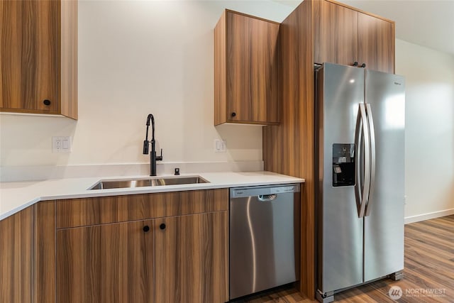 4232 Melrose Ln, Bellingham, WA 98226 - kitchen featuring appliances with stainless steel finishes, modern cabinets, and brown cabinetry