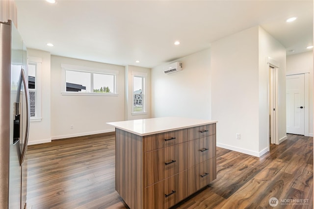 4232 Melrose Ln, Bellingham, WA 98226 - kitchen with stainless steel fridge with ice dispenser, a wall unit AC, modern cabinets, dark wood-type flooring, and recessed lighting
