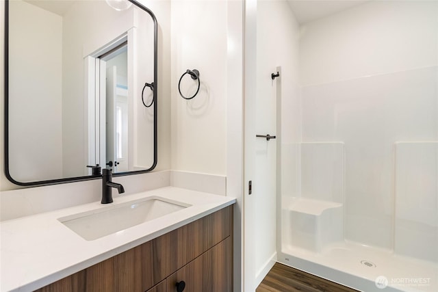 4232 Melrose Ln, Bellingham, WA 98226 - bathroom featuring vanity, wood finished floors, and a shower
