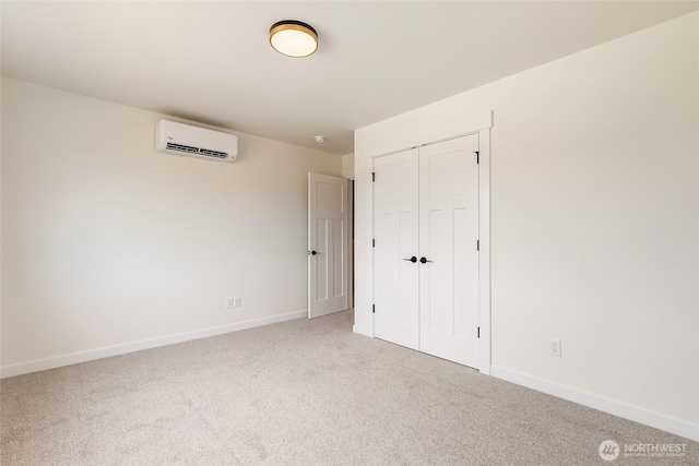4232 Melrose Ln, Bellingham, WA 98226 - unfurnished bedroom featuring a wall unit AC, carpet, and a closet