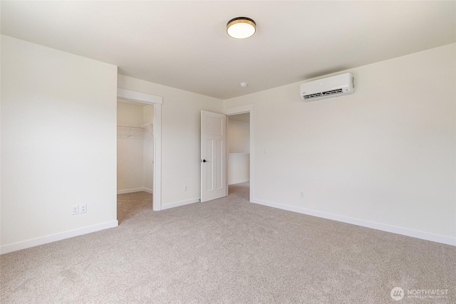 4232 Melrose Ln, Bellingham, WA 98226 - unfurnished bedroom featuring an AC wall unit, light colored carpet, a walk in closet, and a closet
