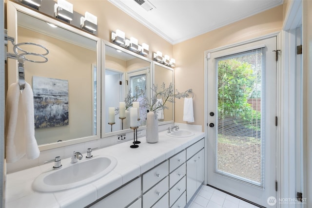 bathroom featuring ornamental molding, tile patterned floors, and double vanity