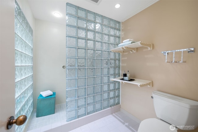 full bathroom featuring walk in shower, tile patterned floors, toilet, and tile walls