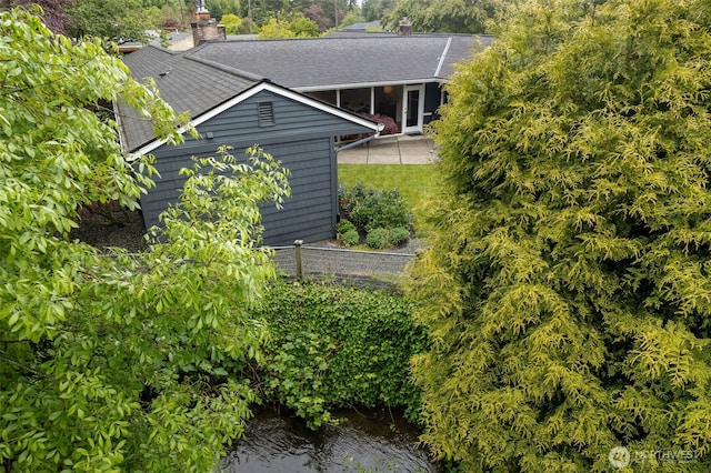 view of subject property with a nearby body of water