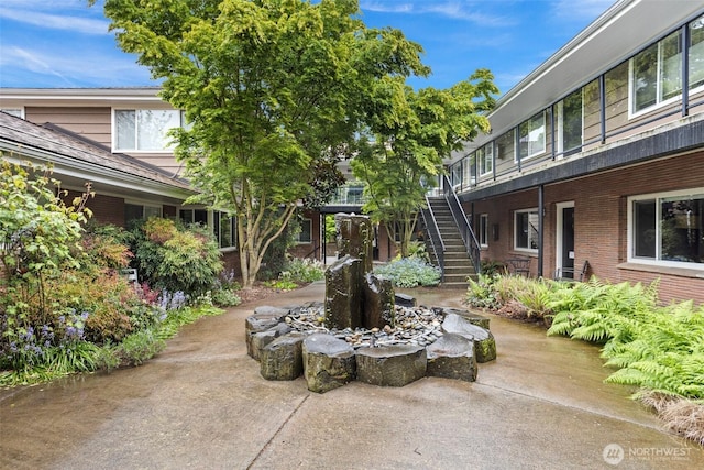 view of patio / terrace featuring stairs