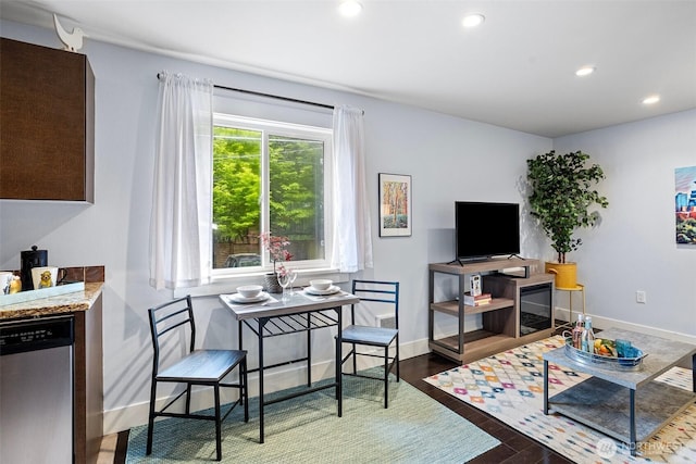 living area with recessed lighting, baseboards, and wood finished floors