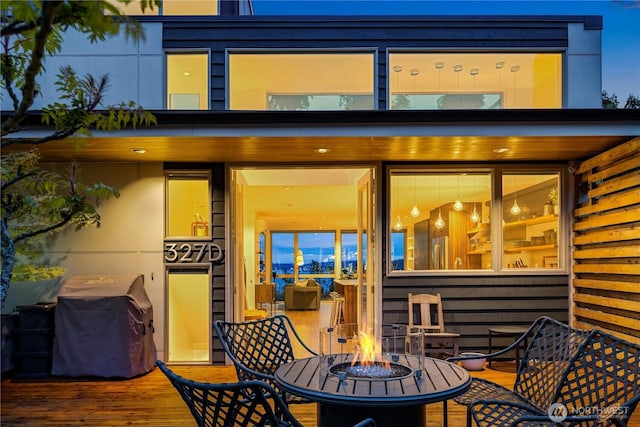 rear view of property with outdoor dining area