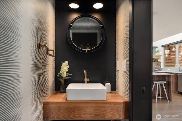 bathroom featuring vanity and wood finished floors