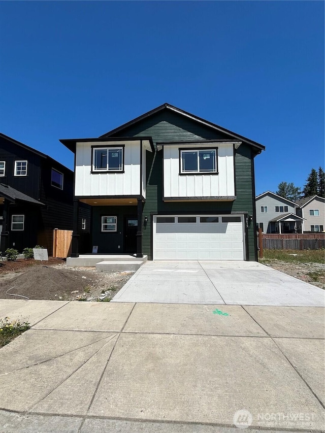 2613 178th Pl NE, Marysville, WA 98271 - view of front of property with a garage, concrete driveway, and board and batten siding
