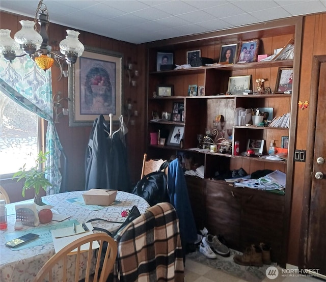 interior space featuring built in features and wood walls