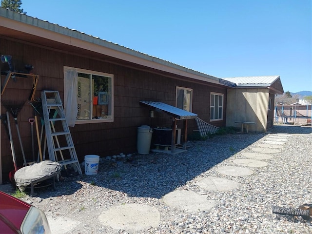 back of property with metal roof