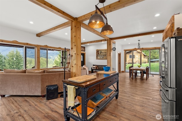 interior space featuring recessed lighting, beam ceiling, and wood finished floors