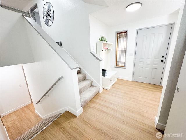 27526 26th Ave S, Federal Way, WA 98003 - foyer entrance featuring wood finished floors, baseboards, and stairway