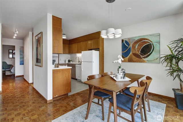 dining area featuring baseboards