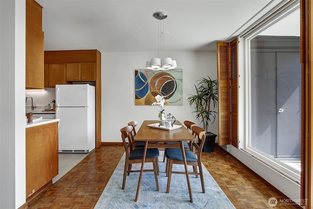 dining space with baseboards