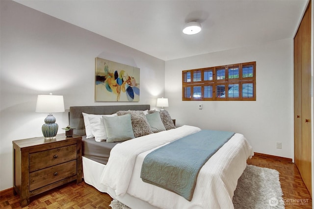 bedroom featuring baseboards