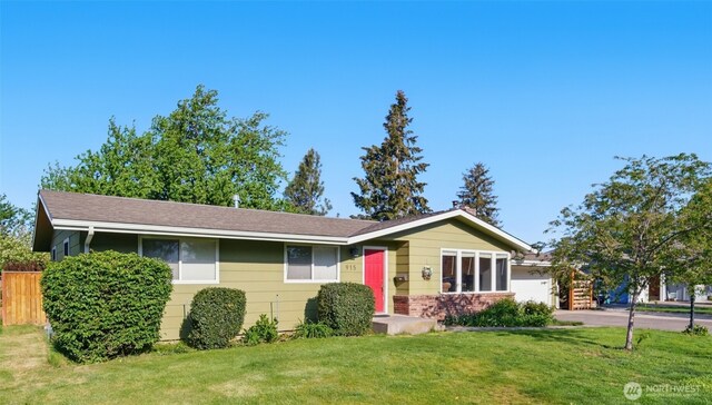 single story home featuring fence and a front yard