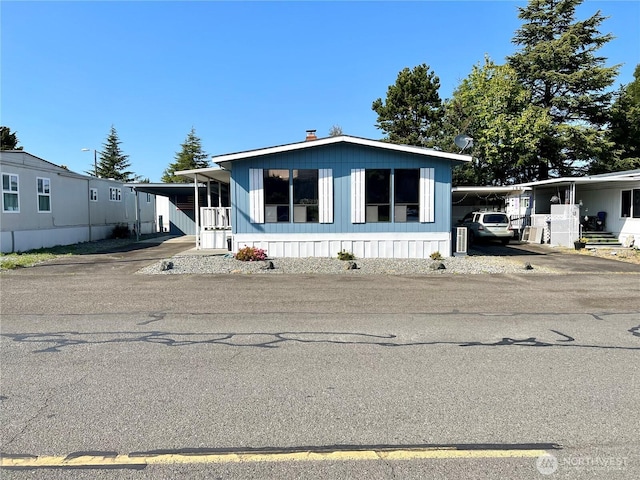 610 W Spruce St, Sequim, WA 98382 - manufactured / mobile home featuring driveway and an attached carport