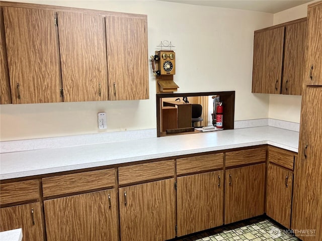 610 W Spruce St, Sequim, WA 98382 - kitchen featuring brown cabinetry and light countertops