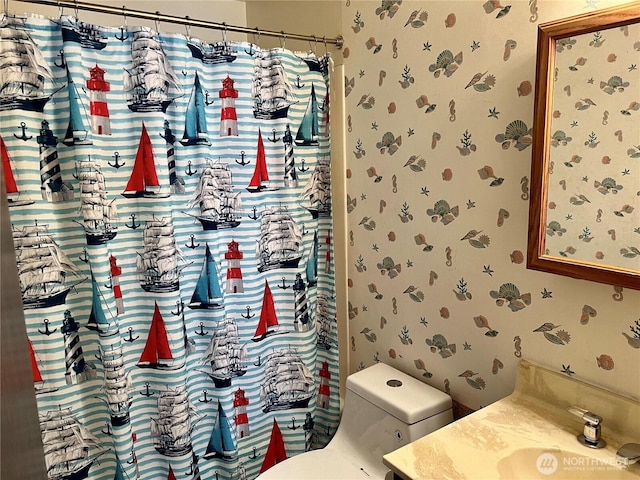 610 W Spruce St, Sequim, WA 98382 - full bath with vanity, toilet, and wallpapered walls