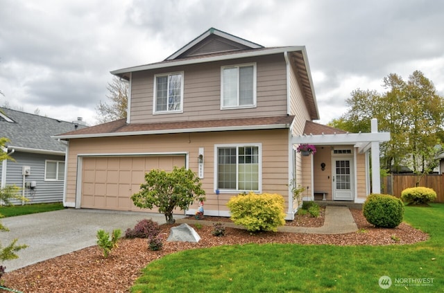 traditional home with a front lawn, driveway, fence, a garage, and roof with shingles