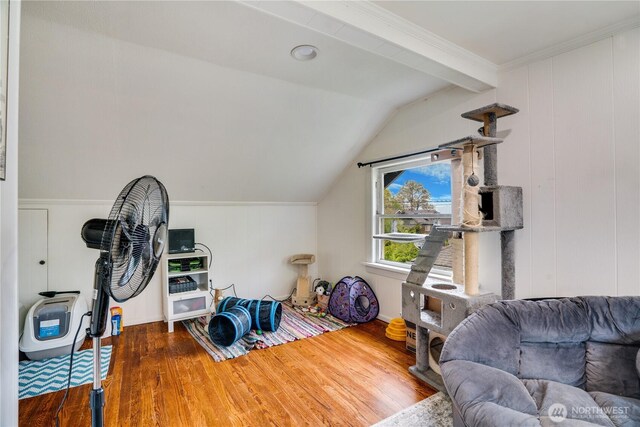 interior space with wood finished floors and lofted ceiling