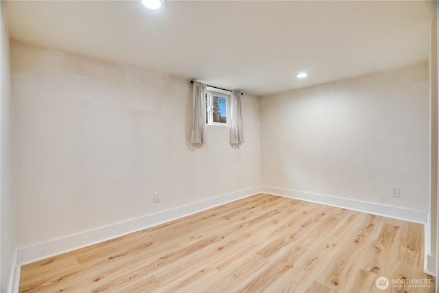unfurnished room featuring baseboards, recessed lighting, and wood finished floors