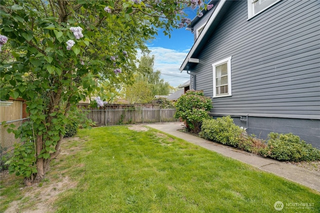 view of yard featuring fence