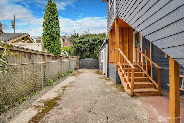 view of home's exterior featuring a gate and fence