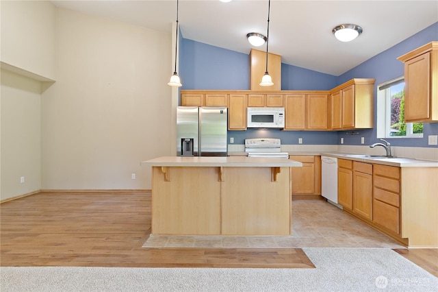 4254 Roxanna Loop SE, Lacey, WA 98503 - kitchen with white appliances, a sink, light countertops, a kitchen bar, and high vaulted ceiling