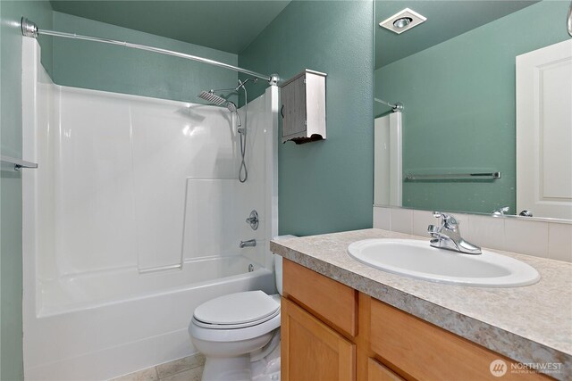 4254 Roxanna Loop SE, Lacey, WA 98503 - bathroom featuring toilet, vanity, bathtub / shower combination, and tile patterned flooring