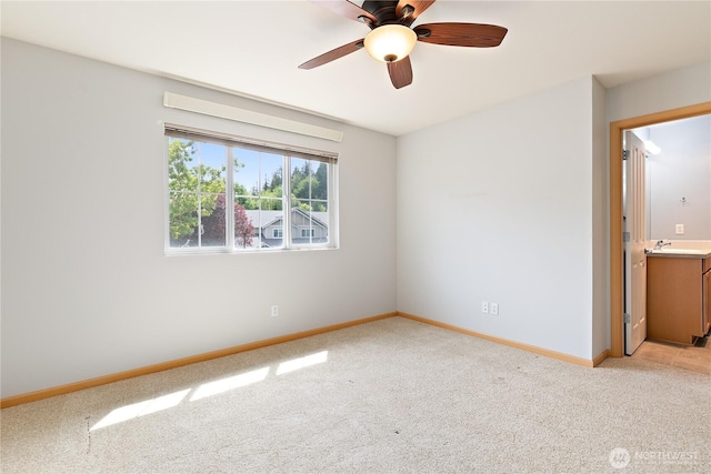 4254 Roxanna Loop SE, Lacey, WA 98503 - unfurnished bedroom featuring light carpet, baseboards, a sink, and a ceiling fan
