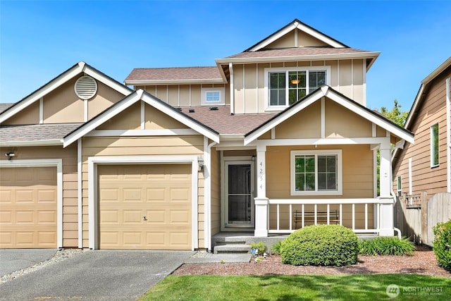 4254 Roxanna Loop SE, Lacey, WA 98503 - view of front of home featuring asphalt driveway, fence, board and batten siding, and a shingled roof