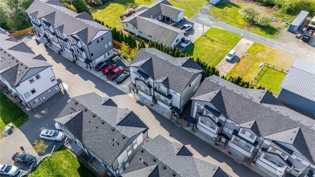 birds eye view of property with a residential view