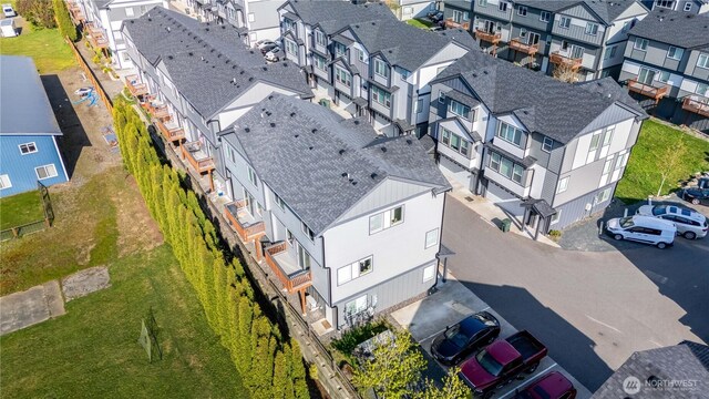 birds eye view of property with a residential view