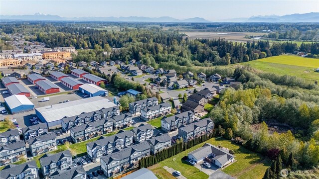 birds eye view of property featuring a mountain view