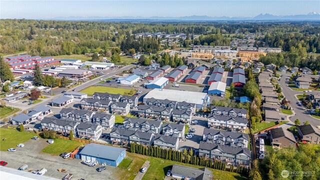 birds eye view of property with a residential view and a forest view