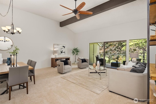 carpeted living area with a chandelier and ceiling fan