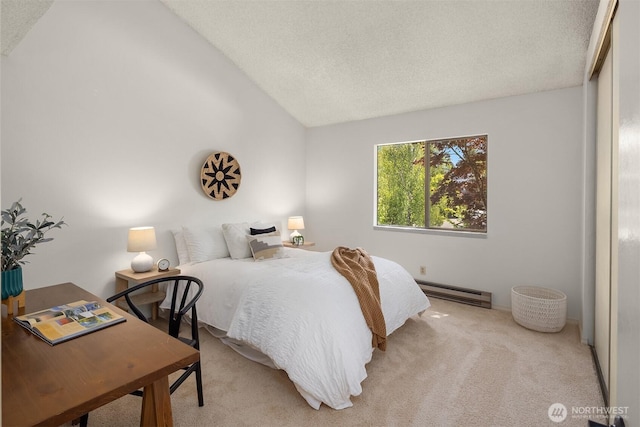 carpeted bedroom featuring vaulted ceiling, baseboard heating, and a textured ceiling