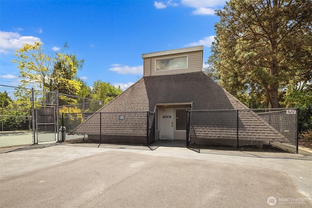 view of front of house featuring a gate and fence