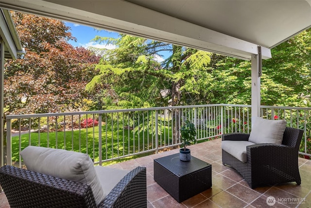 view of patio featuring outdoor lounge area and a balcony