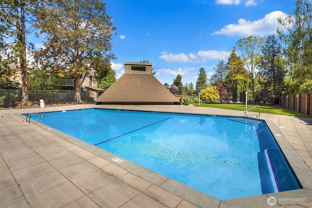 community pool featuring fence