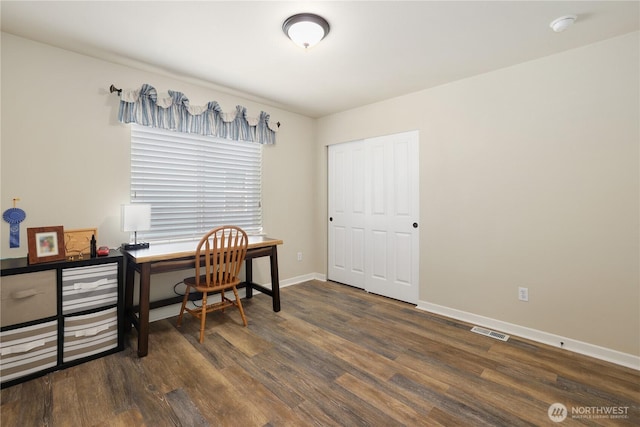 office featuring wood finished floors, visible vents, and baseboards