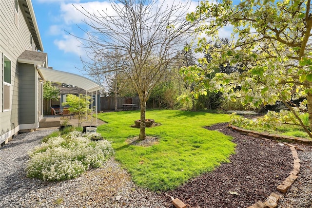view of yard featuring a patio and fence