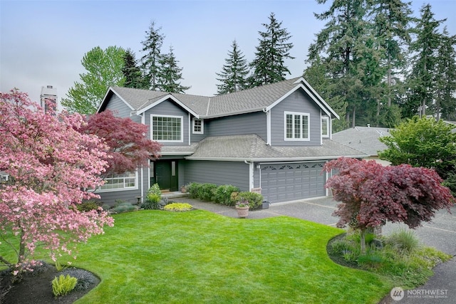 traditional home featuring driveway, a front lawn, roof with shingles, and a garage