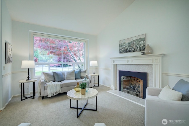 living room with baseboards, carpet flooring, high vaulted ceiling, and a fireplace